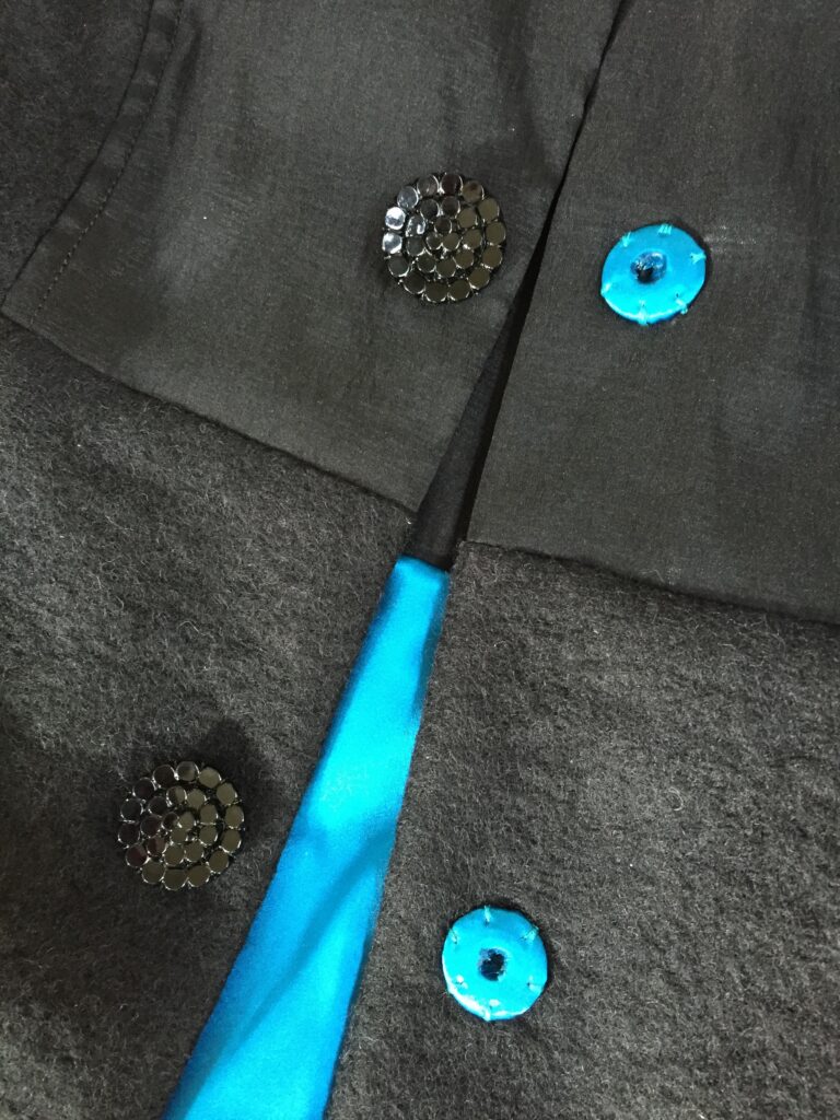 Silk-covered snaps and glass buttons on a Jean Kaori Lantern Coat