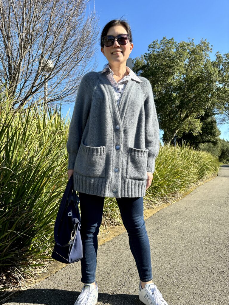 Front view of hand-knit Amalfi Cardigan using Woolfolk Far yarn in color 32