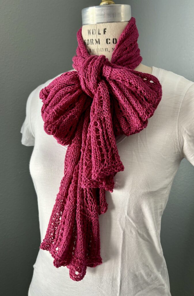 Bow-tied hand-knit scarf in berry pink silk yarn