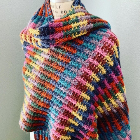 Handknit wrap in a colorful alternating rib pattern