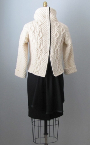 Cropped cable sweater with faux leather trim along back