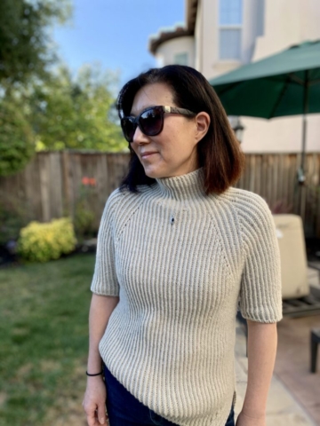 Handknit ribbed sweater with mockneck and elbow-length sleeves